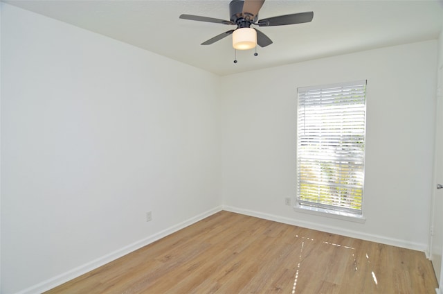 spare room featuring ceiling fan and light hardwood / wood-style flooring