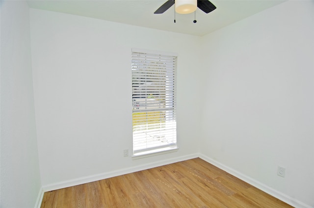 empty room featuring ceiling fan and light hardwood / wood-style floors