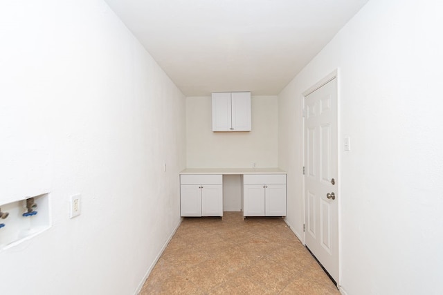 clothes washing area with hookup for a washing machine and cabinets