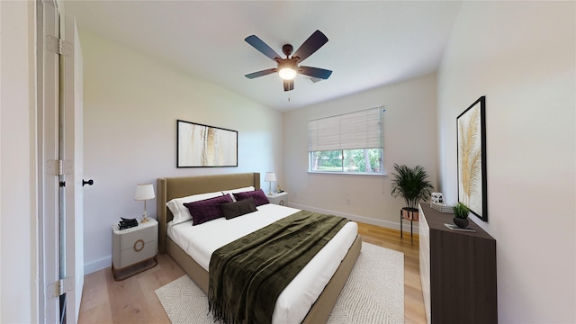 bedroom featuring light wood-type flooring and ceiling fan