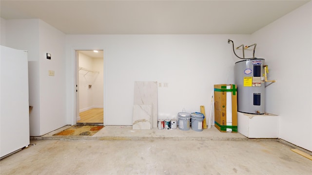 garage with water heater and white refrigerator