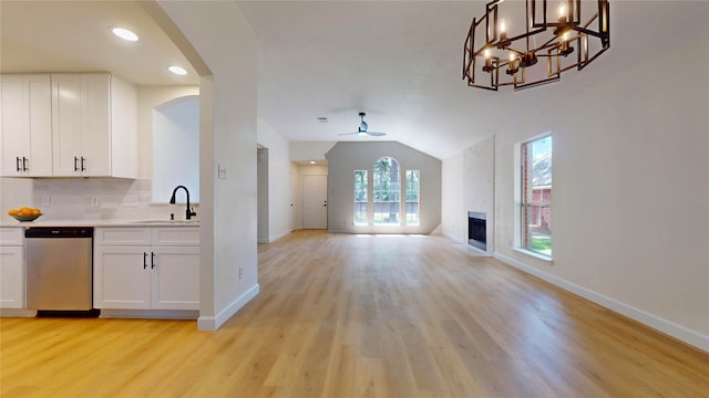 kitchen featuring white cabinets, sink, light hardwood / wood-style floors, ceiling fan with notable chandelier, and dishwasher