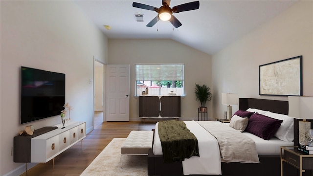 bedroom with ceiling fan, wood-type flooring, and vaulted ceiling