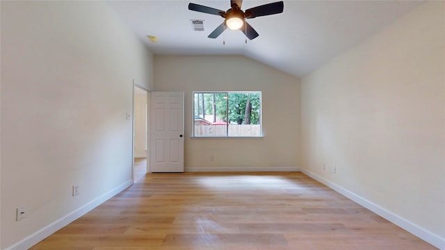 spare room with light hardwood / wood-style floors, lofted ceiling, and ceiling fan