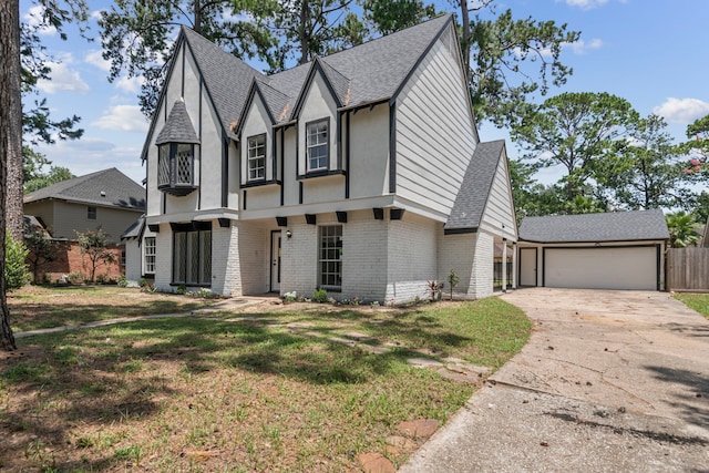 view of front of home featuring a garage and a front lawn