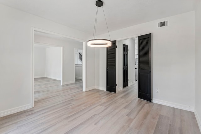 unfurnished dining area with light hardwood / wood-style flooring