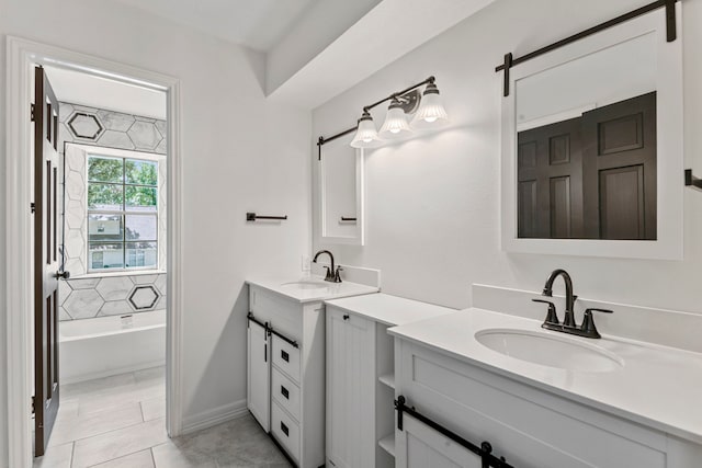 bathroom featuring vanity, a tub, and tile patterned floors