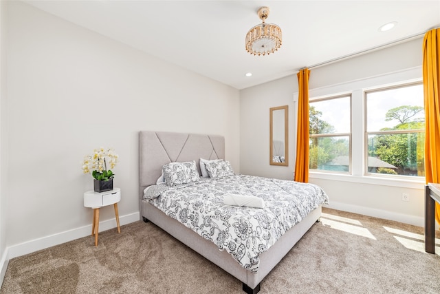 bedroom with light colored carpet