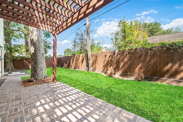 view of yard with a pergola and a patio