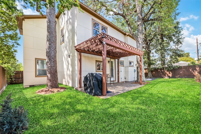 rear view of property with a patio, a lawn, and a pergola