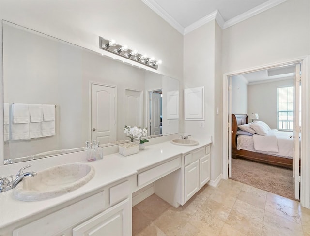 bathroom featuring ornamental molding and vanity