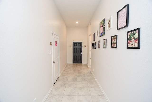 hallway with light tile patterned floors