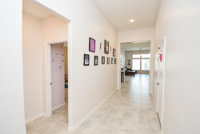 corridor featuring light tile patterned flooring