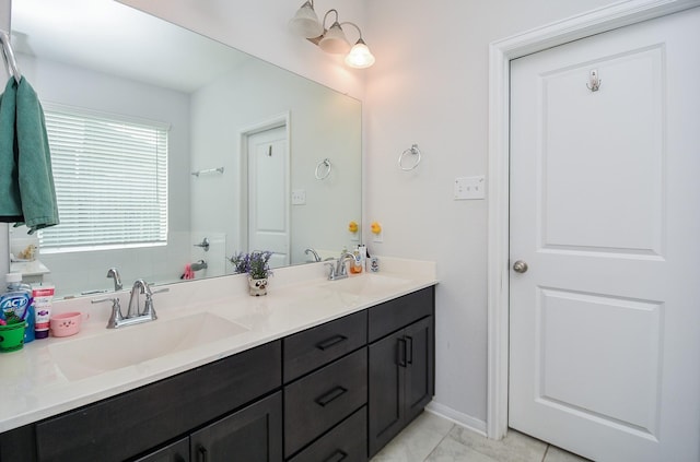 bathroom with tile patterned floors and vanity