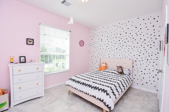 bedroom featuring multiple windows