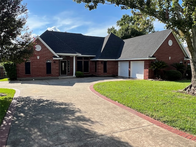 view of front of home with a garage and a front yard