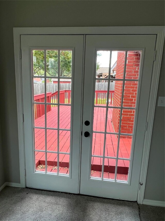 doorway with carpet and french doors