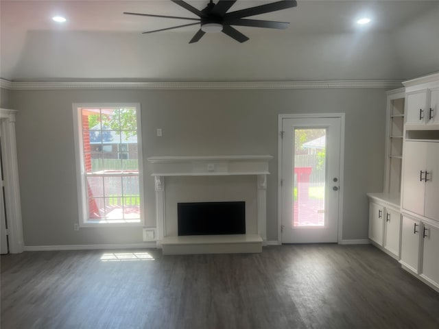 unfurnished living room featuring dark hardwood / wood-style floors and a wealth of natural light