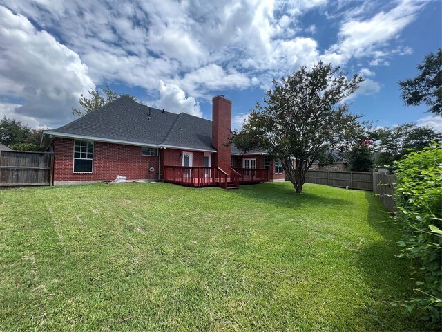 view of yard with a wooden deck