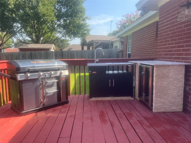 wooden terrace with grilling area