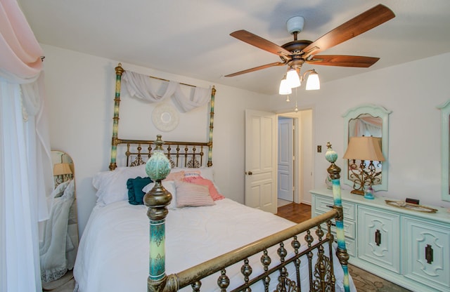 bedroom featuring ceiling fan and dark hardwood / wood-style floors