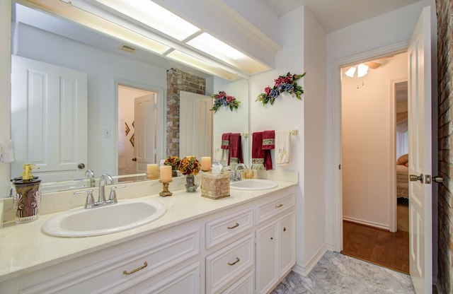 bathroom featuring vanity and hardwood / wood-style flooring