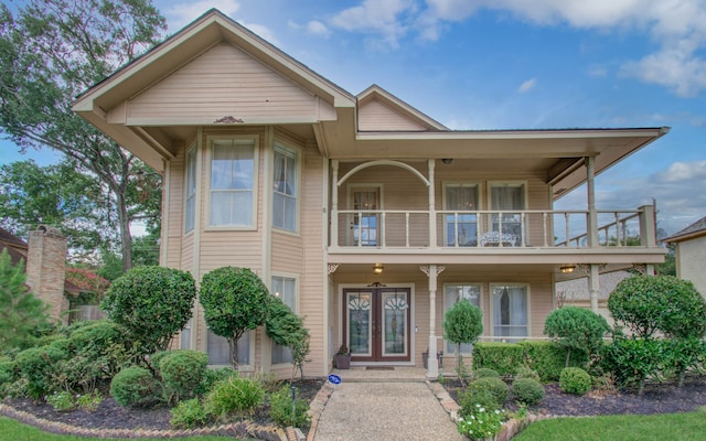 view of front of house featuring a balcony