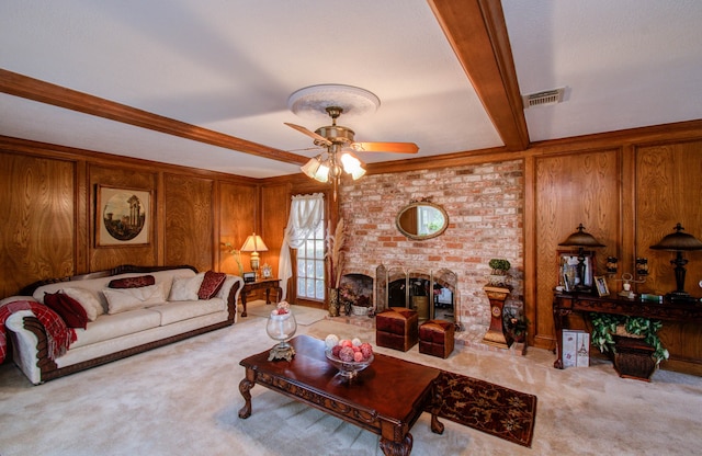 carpeted living room featuring ceiling fan, a fireplace, wood walls, and beam ceiling