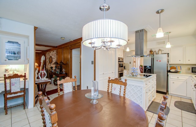 dining room featuring a chandelier and light tile patterned flooring