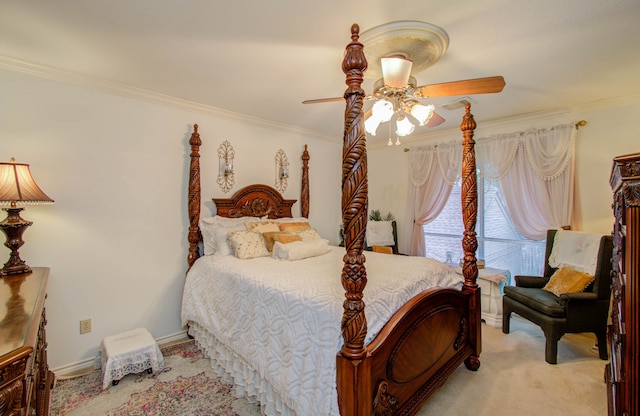 carpeted bedroom with ceiling fan and crown molding