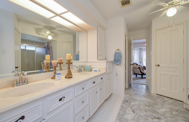 bathroom featuring ceiling fan, a shower, and vanity