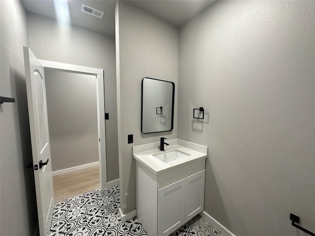 bathroom featuring tile patterned floors and vanity