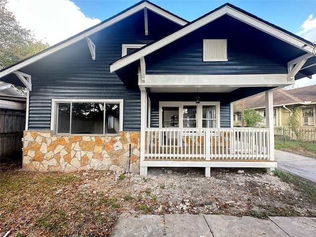 back of house featuring covered porch