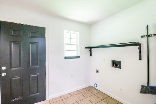 laundry room with gas dryer hookup, electric dryer hookup, washer hookup, and light tile patterned floors