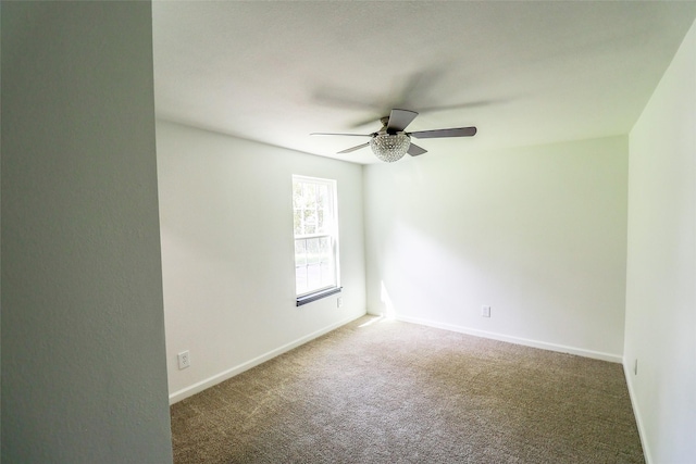 carpeted empty room with ceiling fan