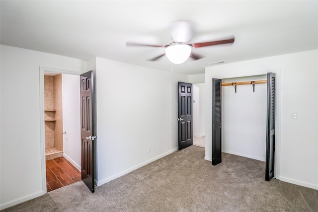 unfurnished bedroom with ceiling fan, carpet floors, and a closet