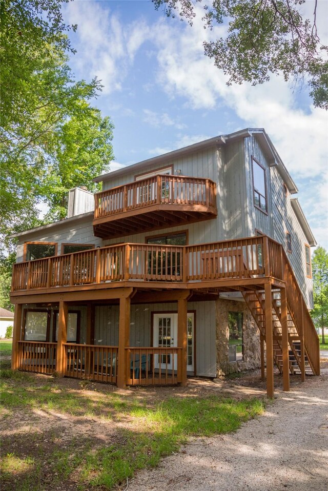 rear view of property featuring a deck