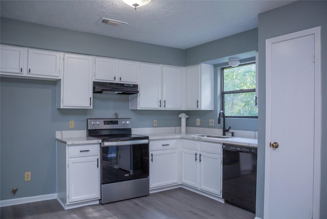 kitchen with sink, black dishwasher, stainless steel electric stove, a textured ceiling, and white cabinets