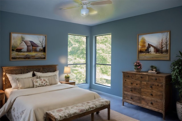 bedroom with ceiling fan and carpet