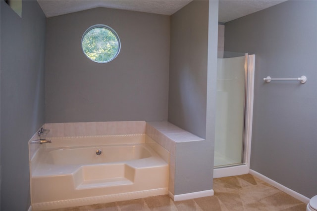 bathroom featuring lofted ceiling and shower with separate bathtub