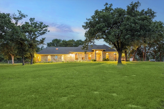 view of front of home featuring a yard