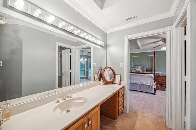 ensuite bathroom with visible vents, ornamental molding, connected bathroom, ceiling fan, and vanity