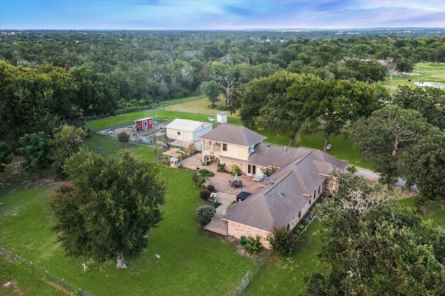 bird's eye view featuring a wooded view