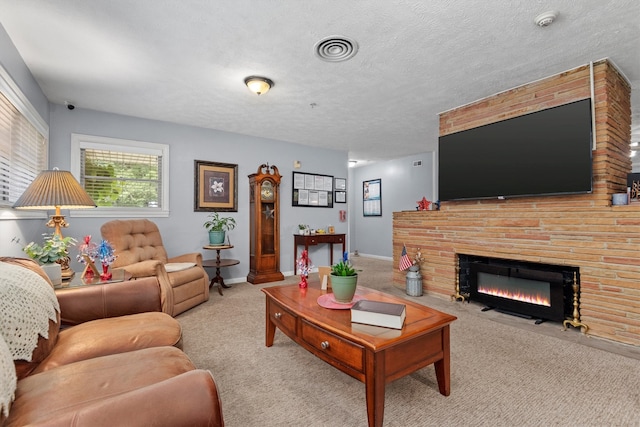 carpeted living room featuring a textured ceiling