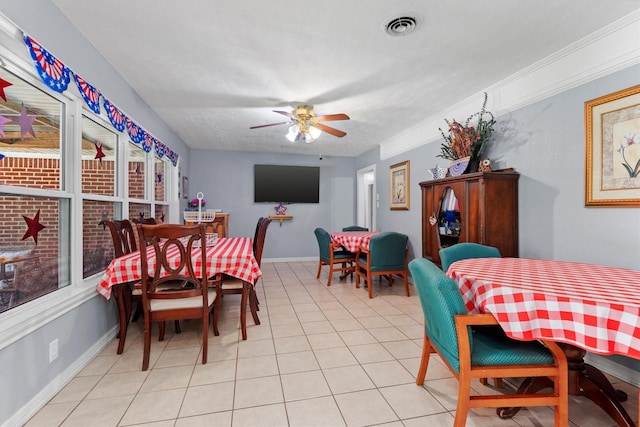 dining area with ceiling fan and light tile patterned flooring