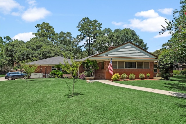 ranch-style home with a front yard