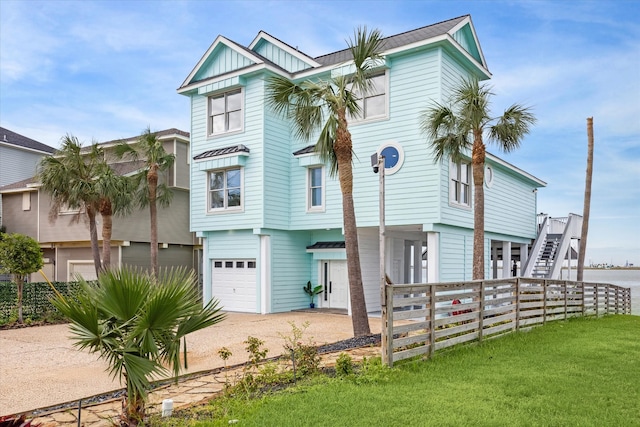 view of front of house featuring a front yard and a garage