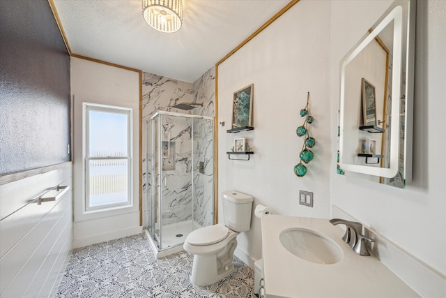 bathroom with toilet, an enclosed shower, a textured ceiling, and vanity