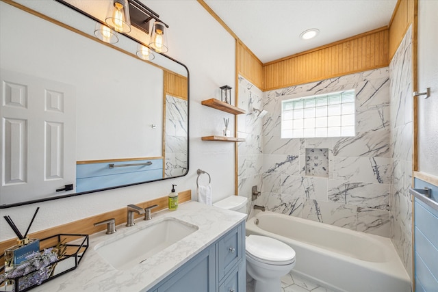 full bathroom featuring toilet, tiled shower / bath combo, and vanity