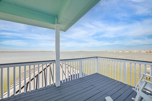 wooden deck featuring a water view